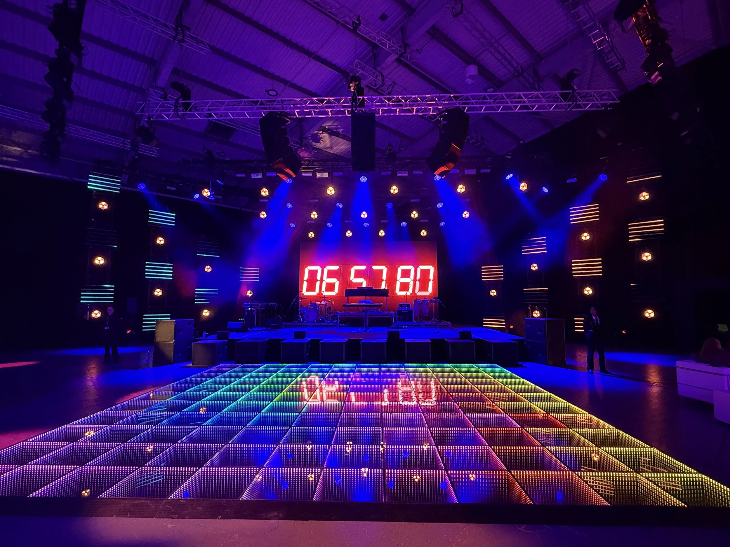Corporate event with professional lighting and a DJ booth