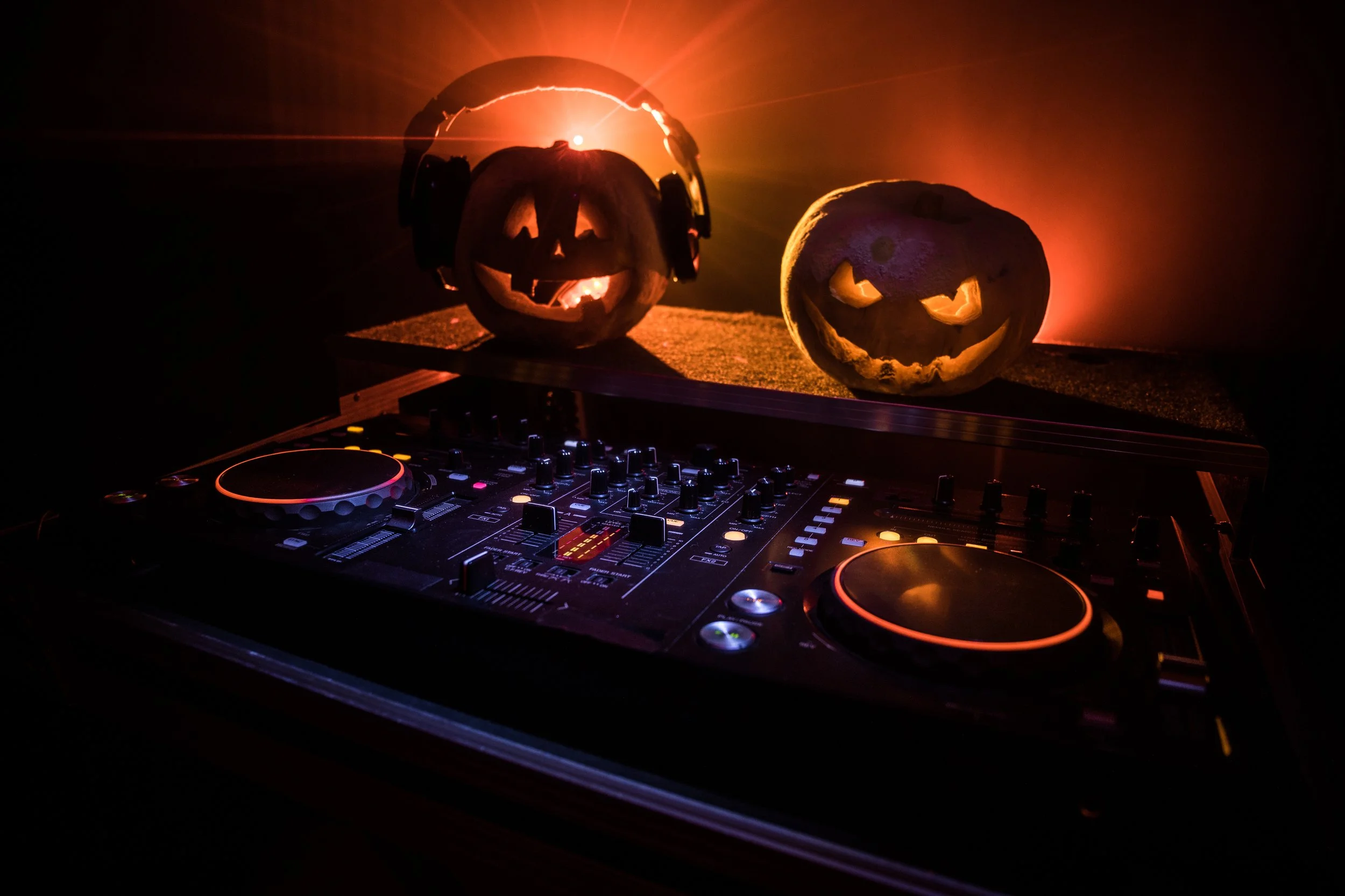 DJ booth with Halloween-themed visuals