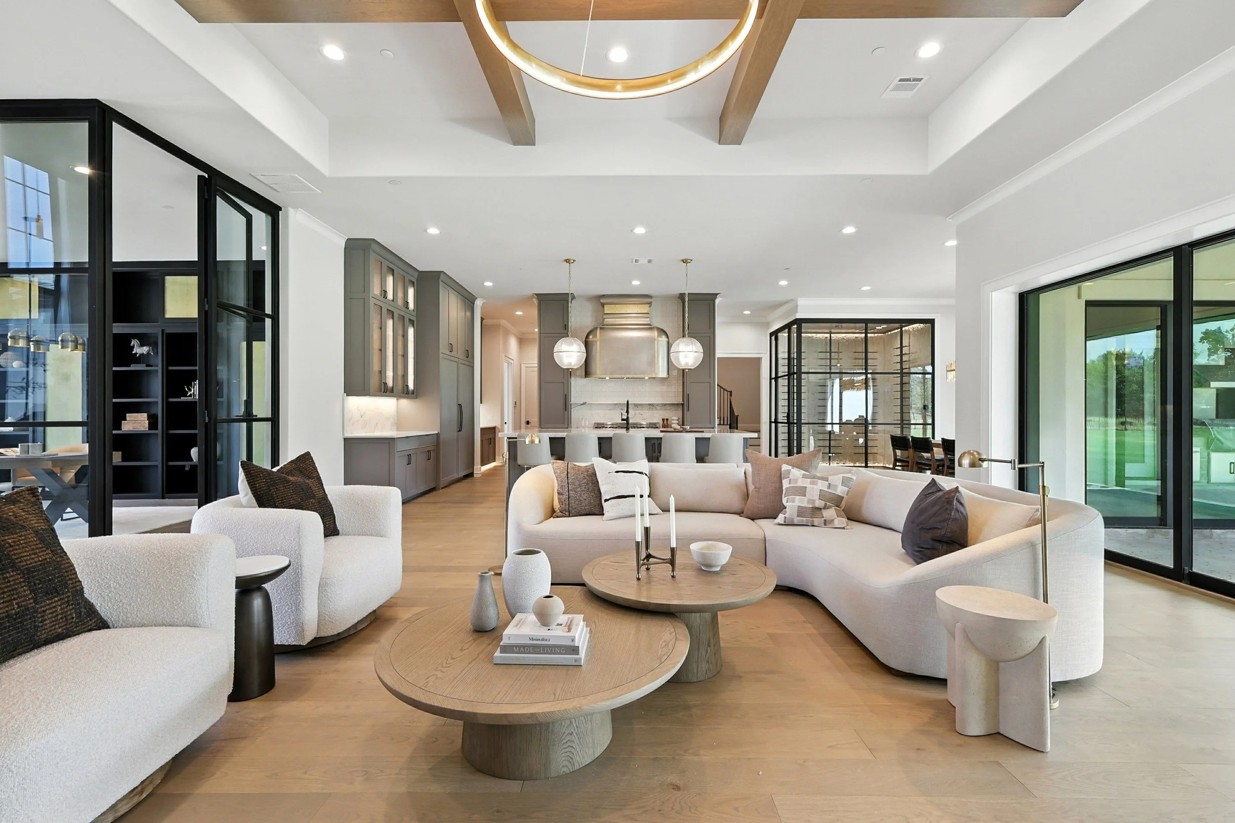 Bright living room with kitchen beyond