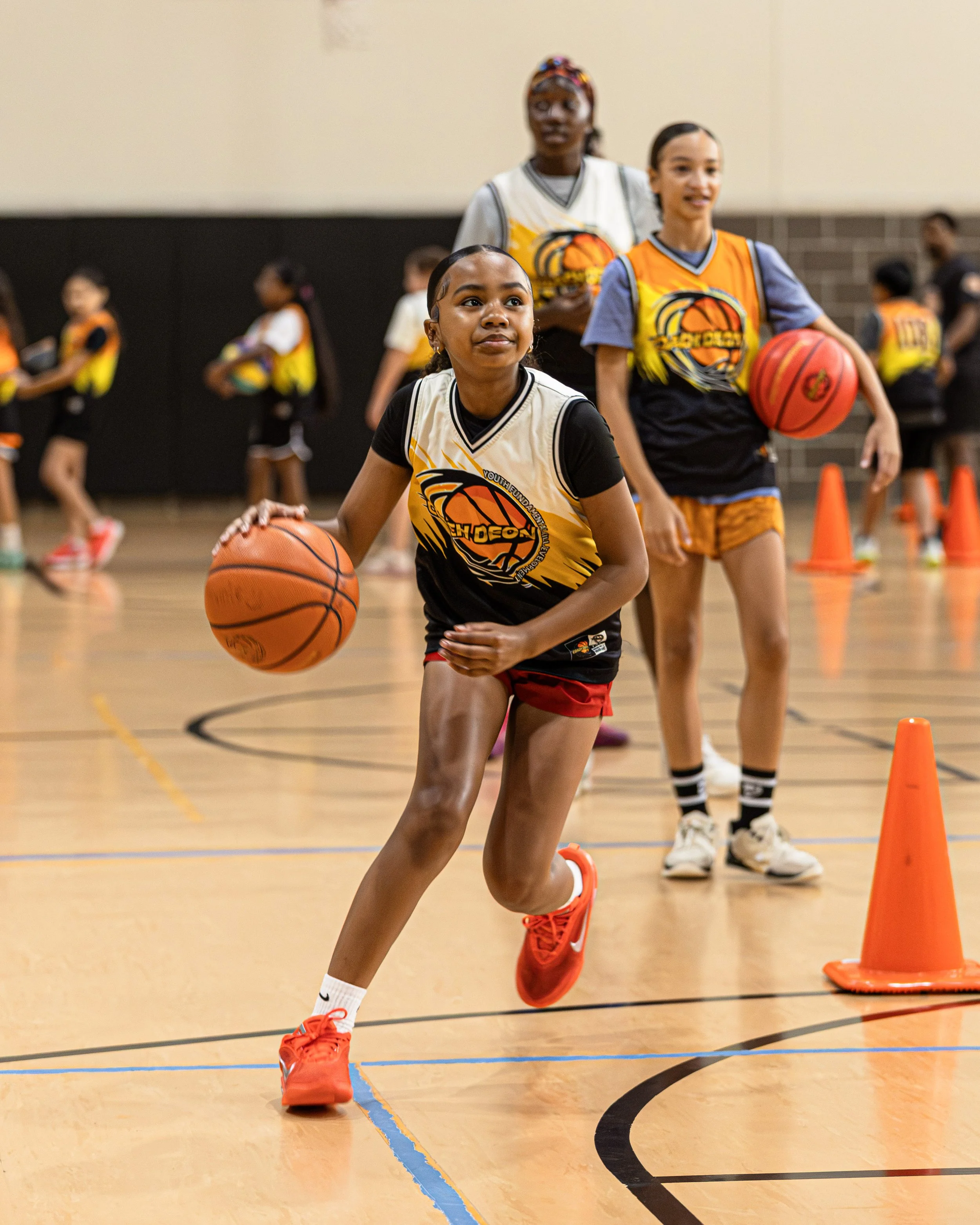 Coach Deon working directly with basketball players during development training