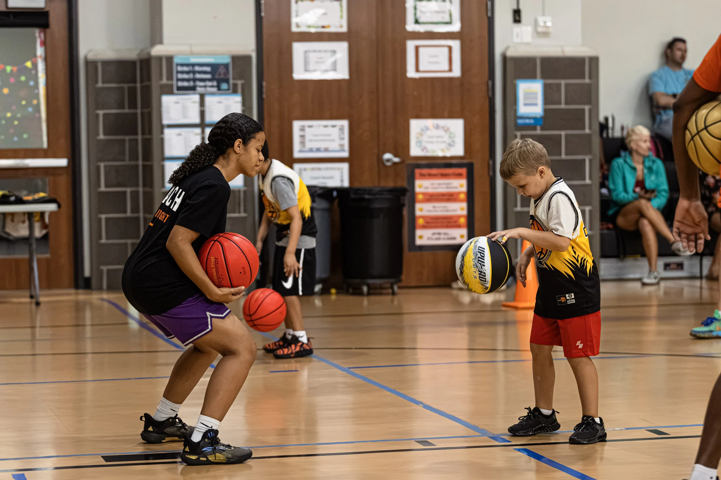Young basketball player developing skills during a Coach Deon Basketball program in The Woodlands.