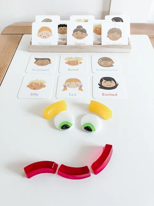 Emotions flashcards with mix-and-match translucent face pieces for building expressions