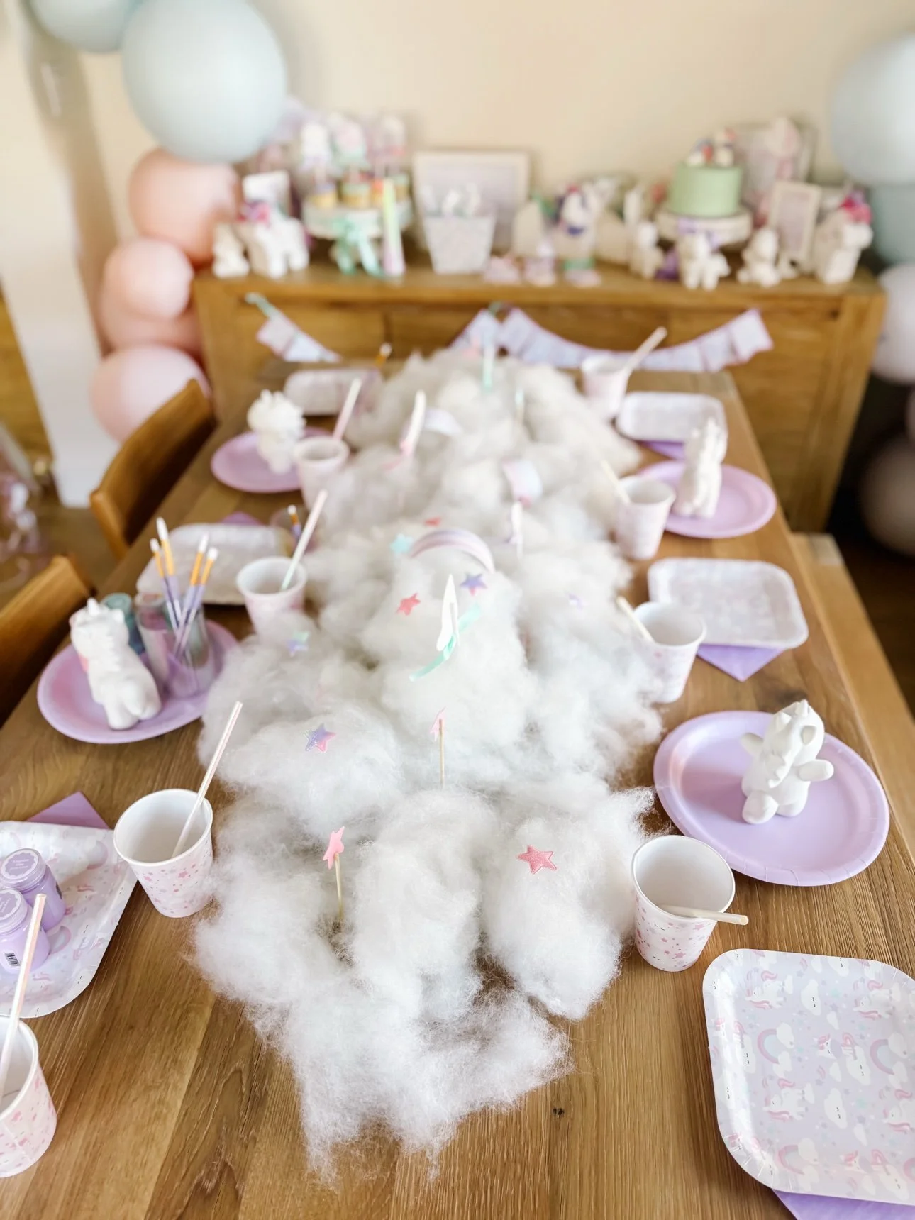 Close-up of cotton cloud table runner with star and rainbow picks