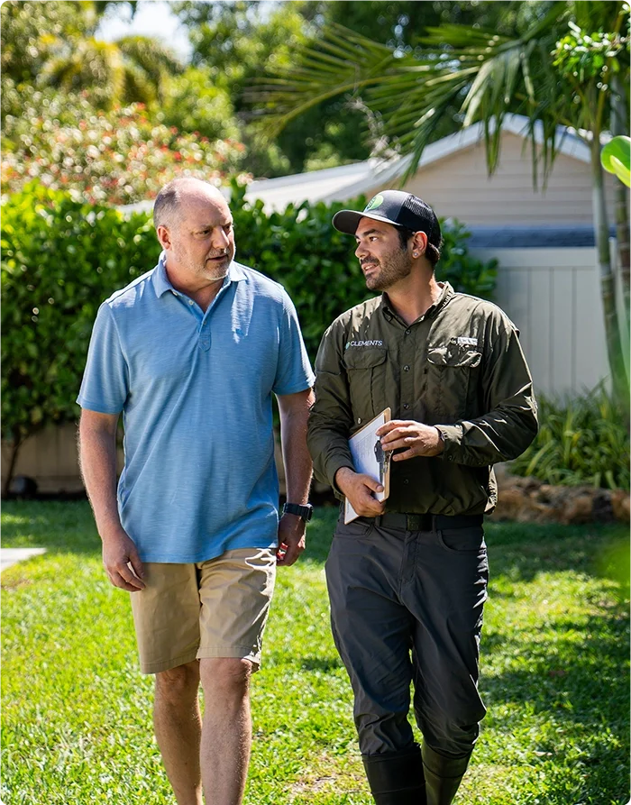 A Clements specialist walking a customer through their lawn care plan