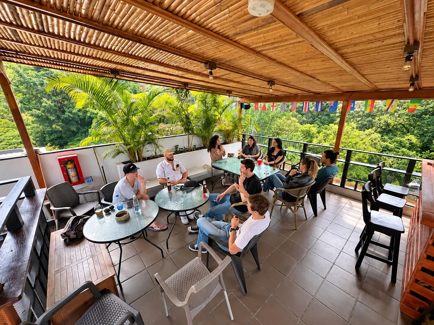 Guests talking on the covered terrace