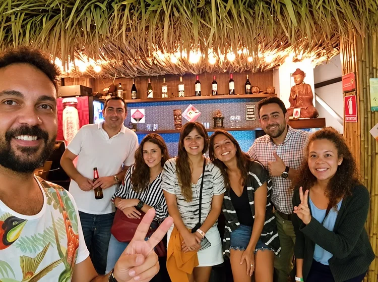 Guests and staff at the bar