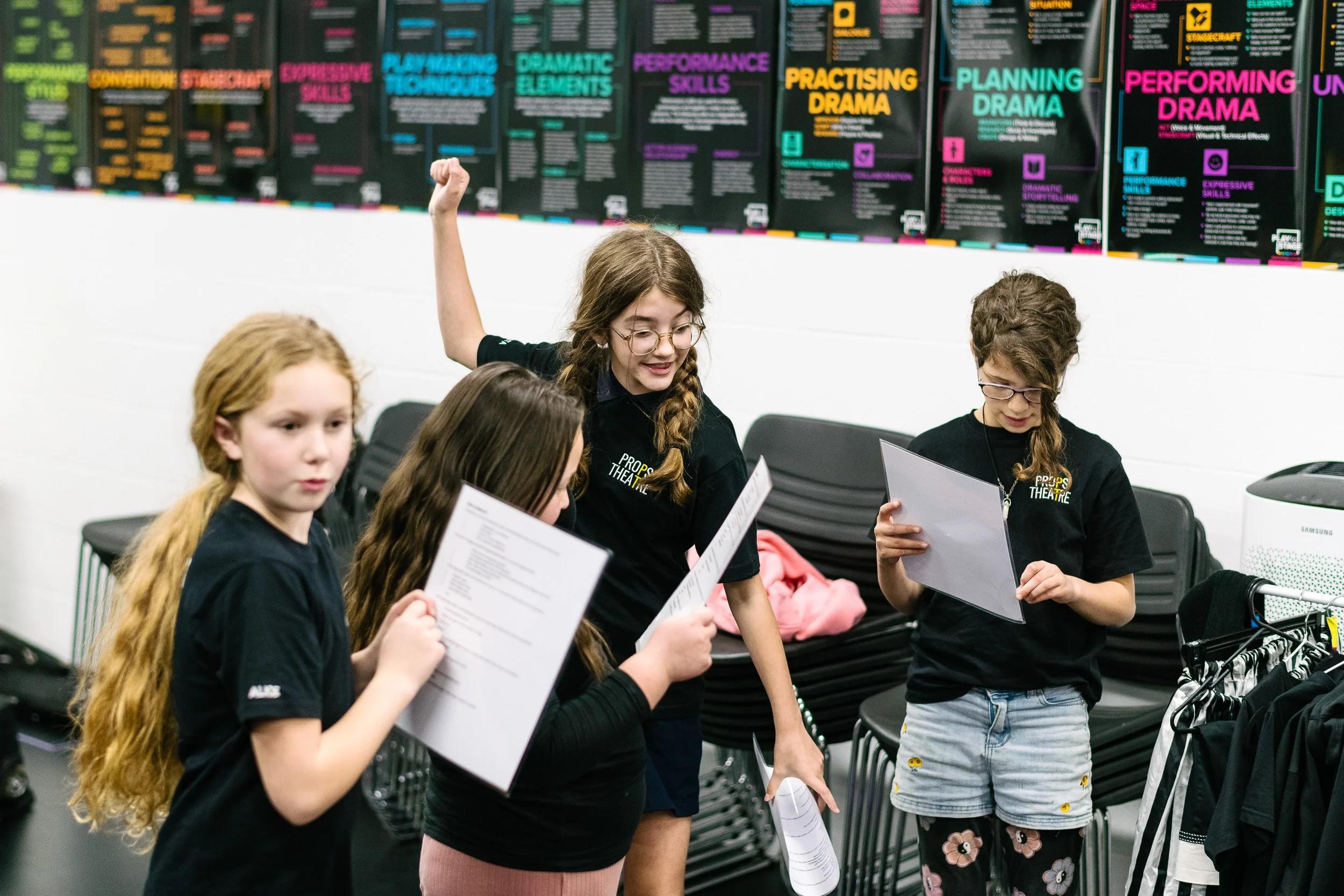 Students rehearsing a scene from a script