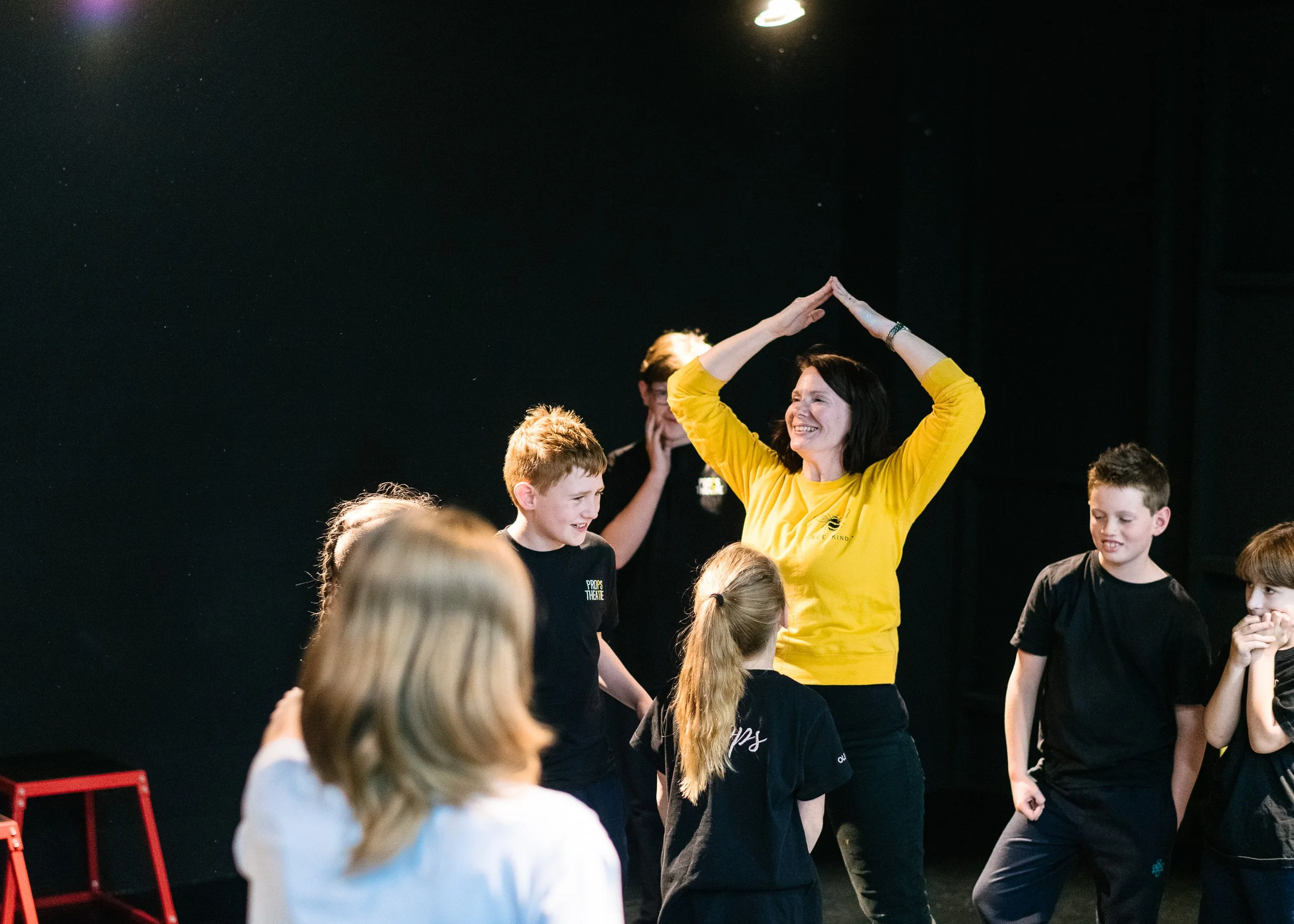 Students taking part in a drama game in class