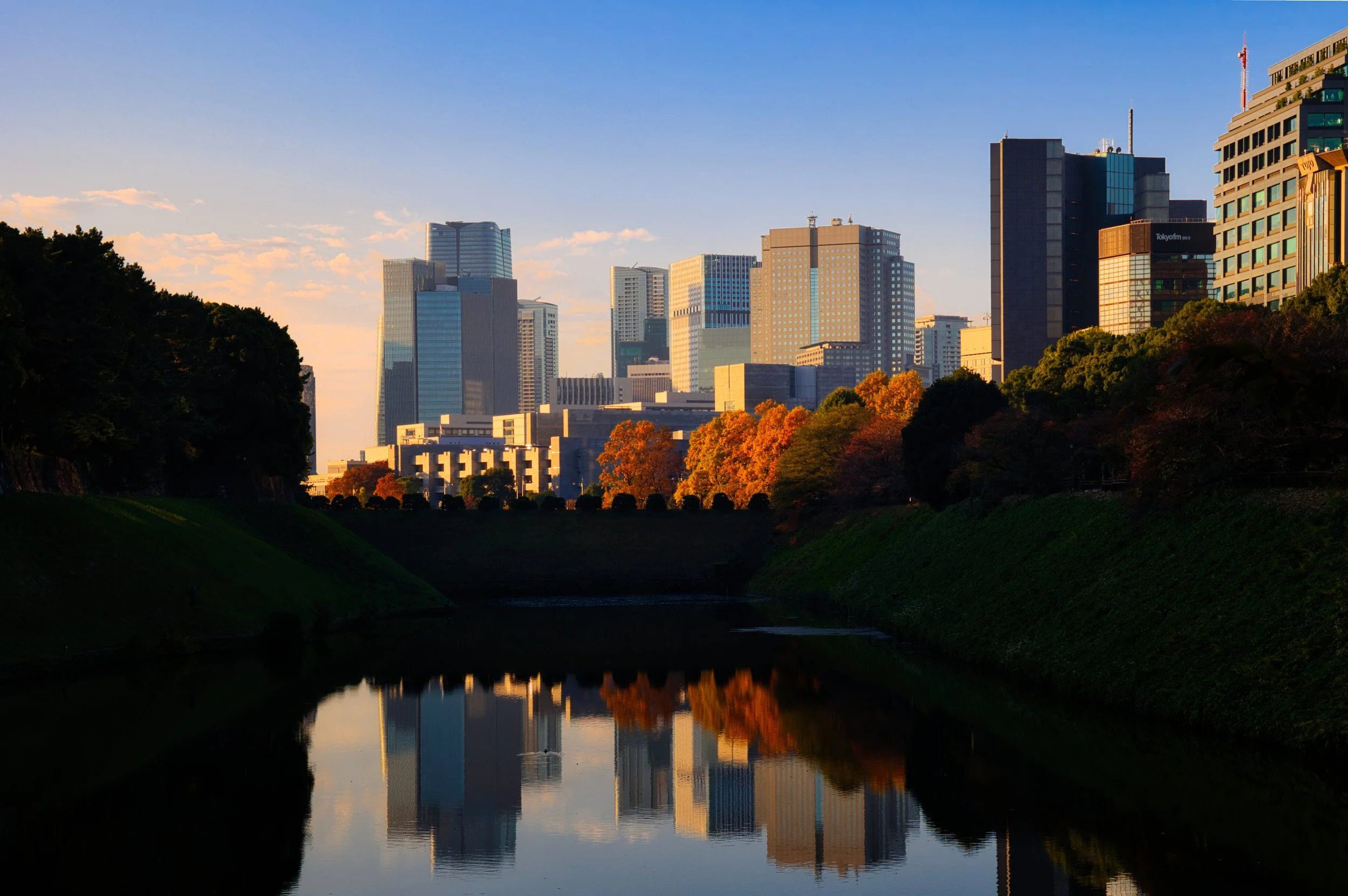 Reflection of autumn colours in a Japanese temple pond