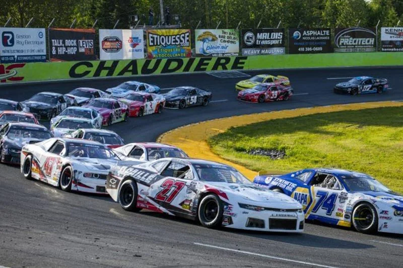 NASCAR race cars representing fuel supply client
