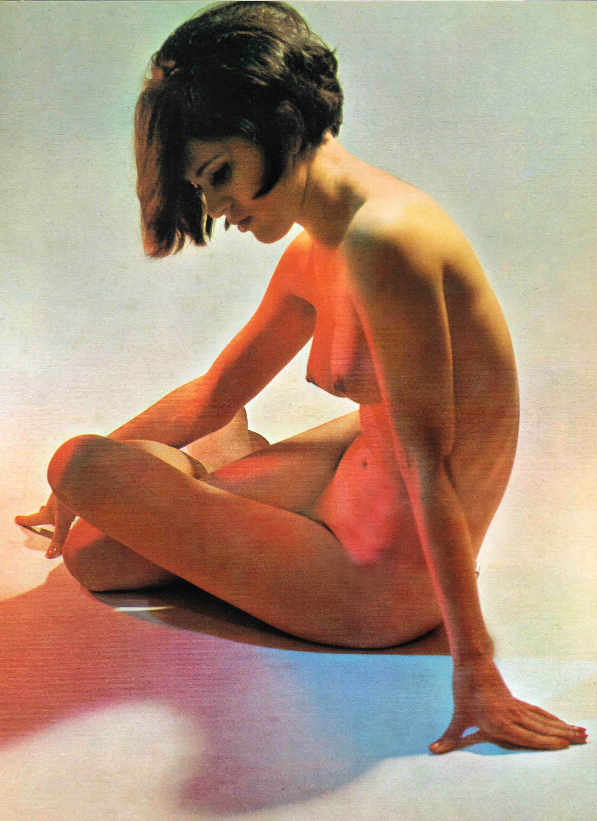Vintage photograph of nude model with bob haircut. 