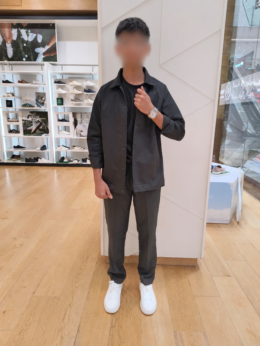 ALDO staff member wearing the charcoal twill jacket and matching trousers