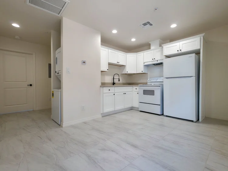 1 bedroom kitchen and entry with washer and dryer