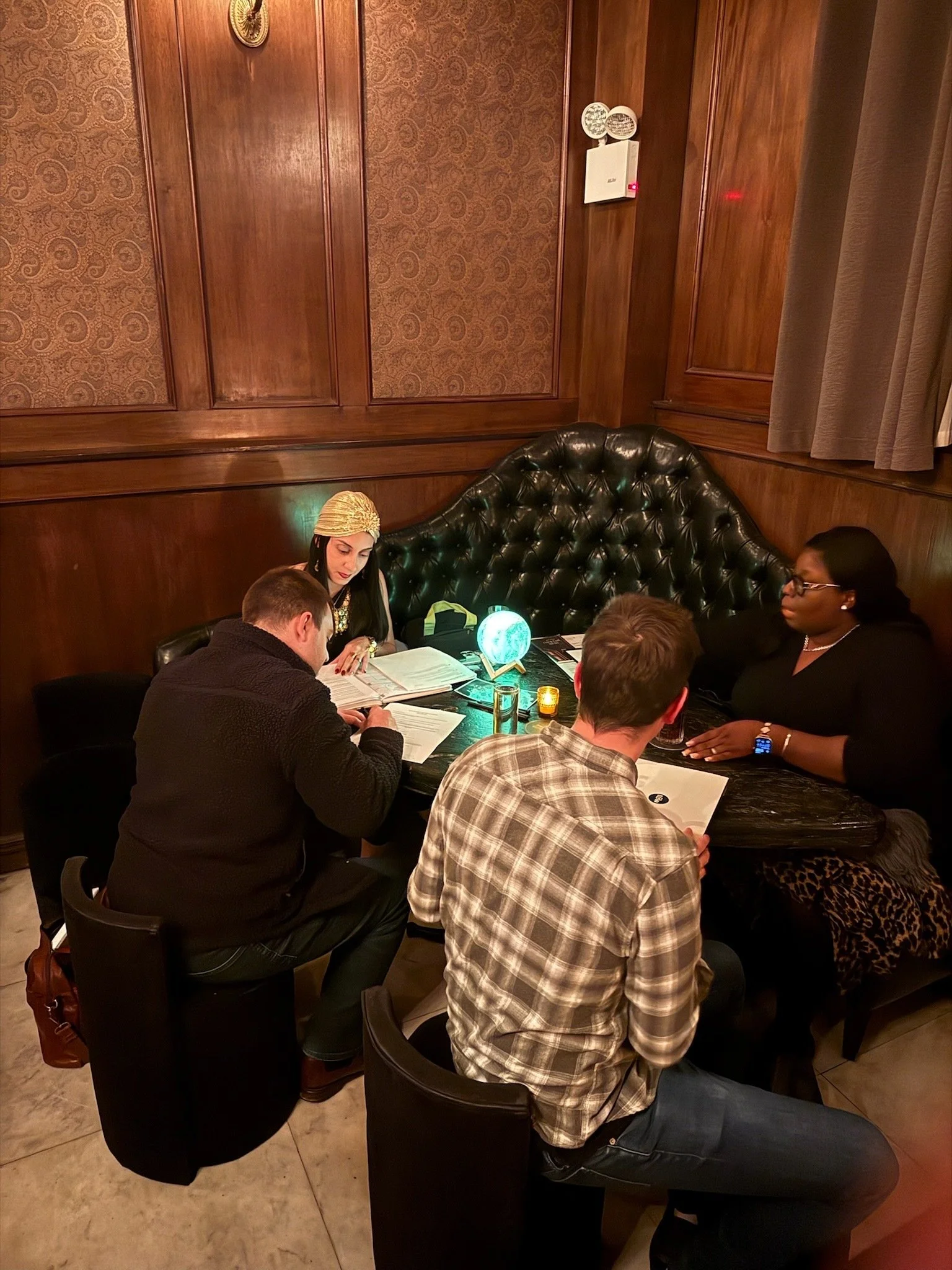 Guests signing estate planning documents with a notary at Martinis & Mortality