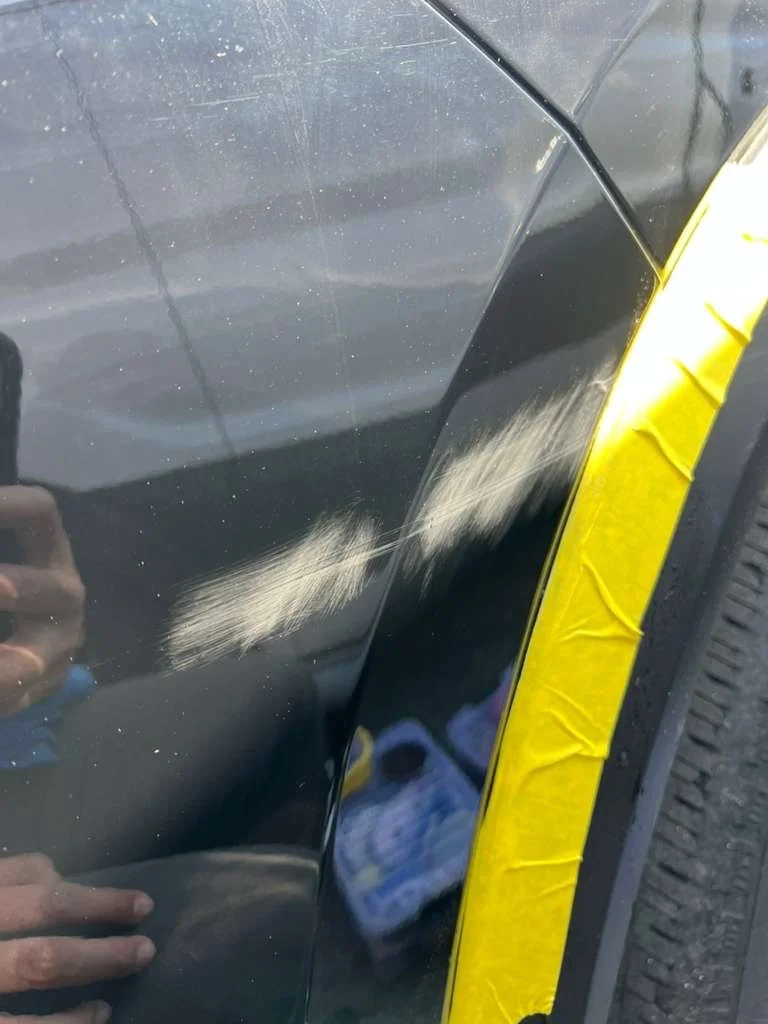 Deep car door scratch before repair