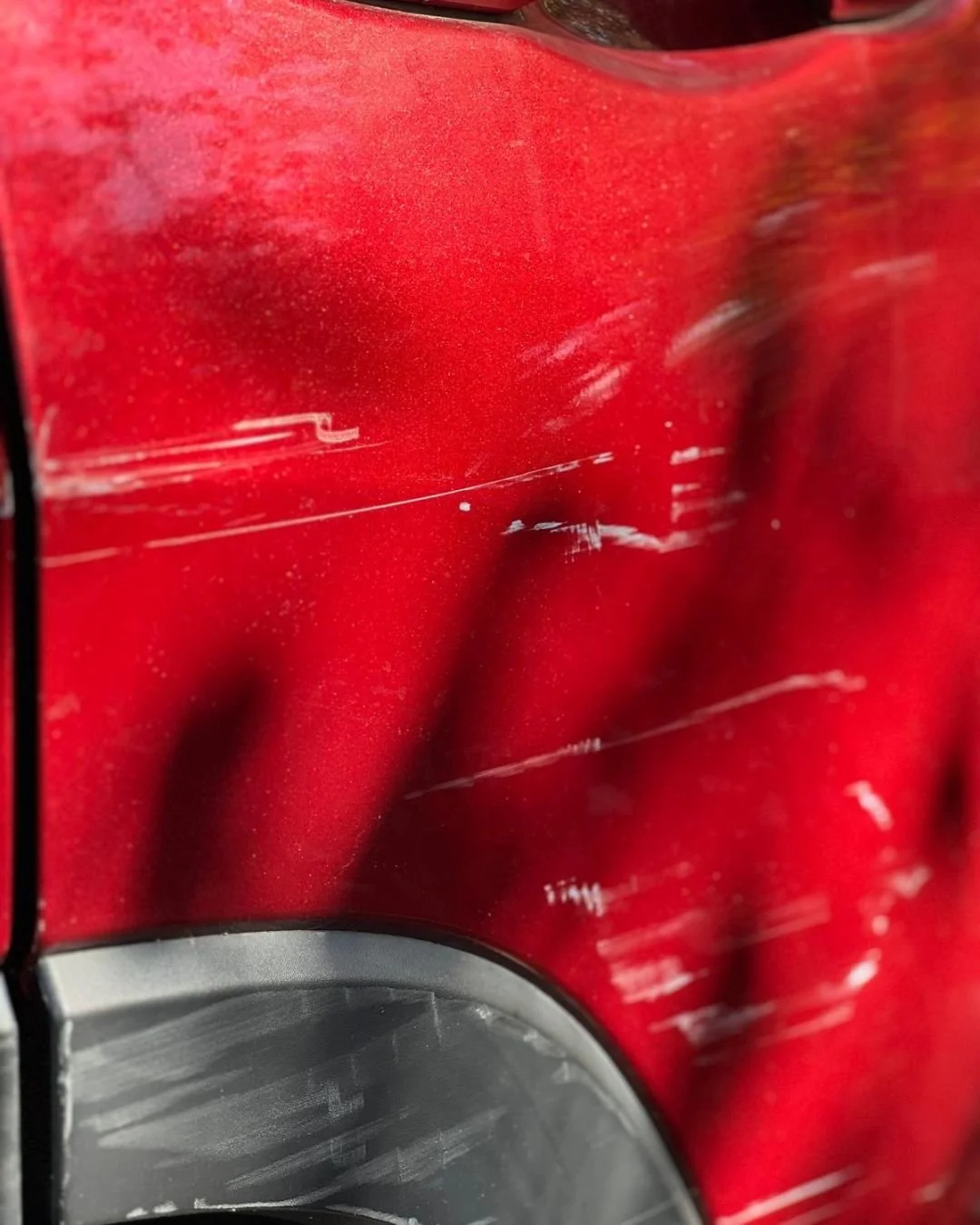 Deep car door scratch before repair