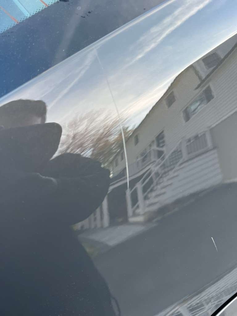 Heavy scuff and clear coat damage before repair