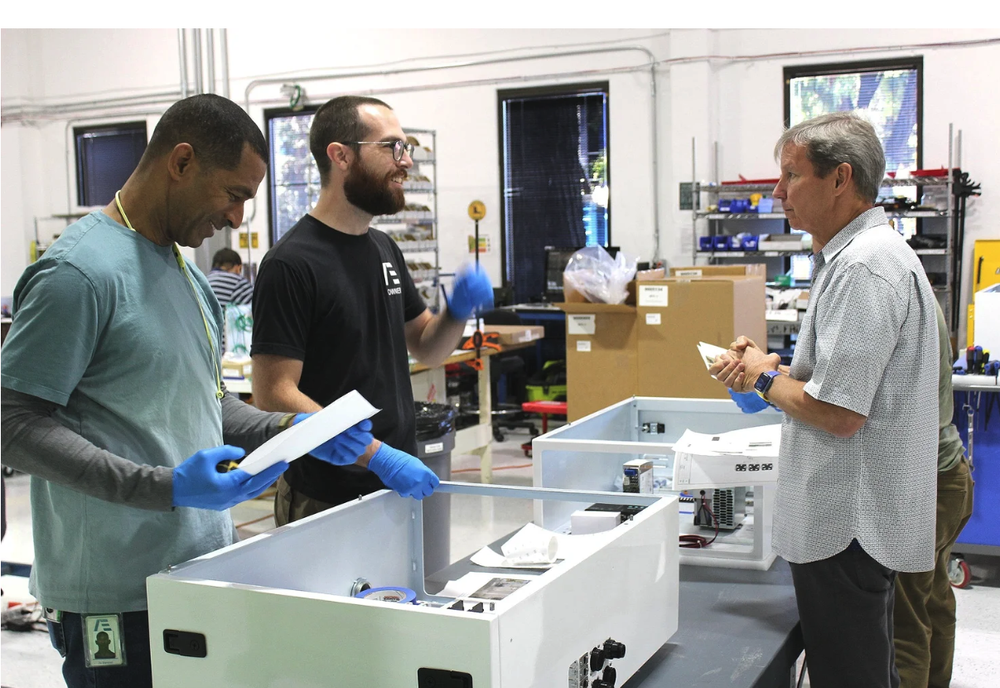 Applied Engineering NPI team reviewing a control panel build in San Jose