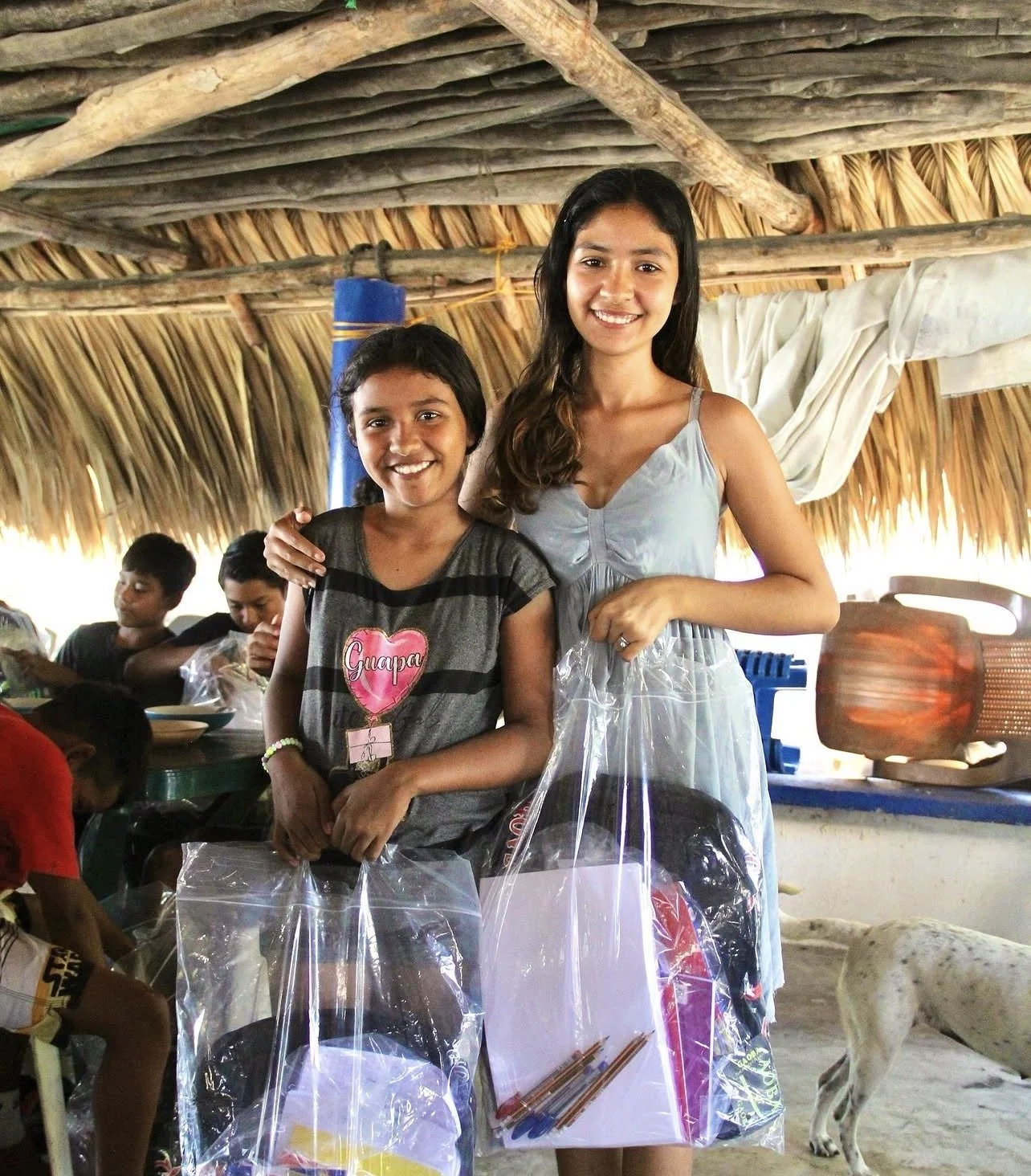 Kids with new backpacks and school supplies (2)