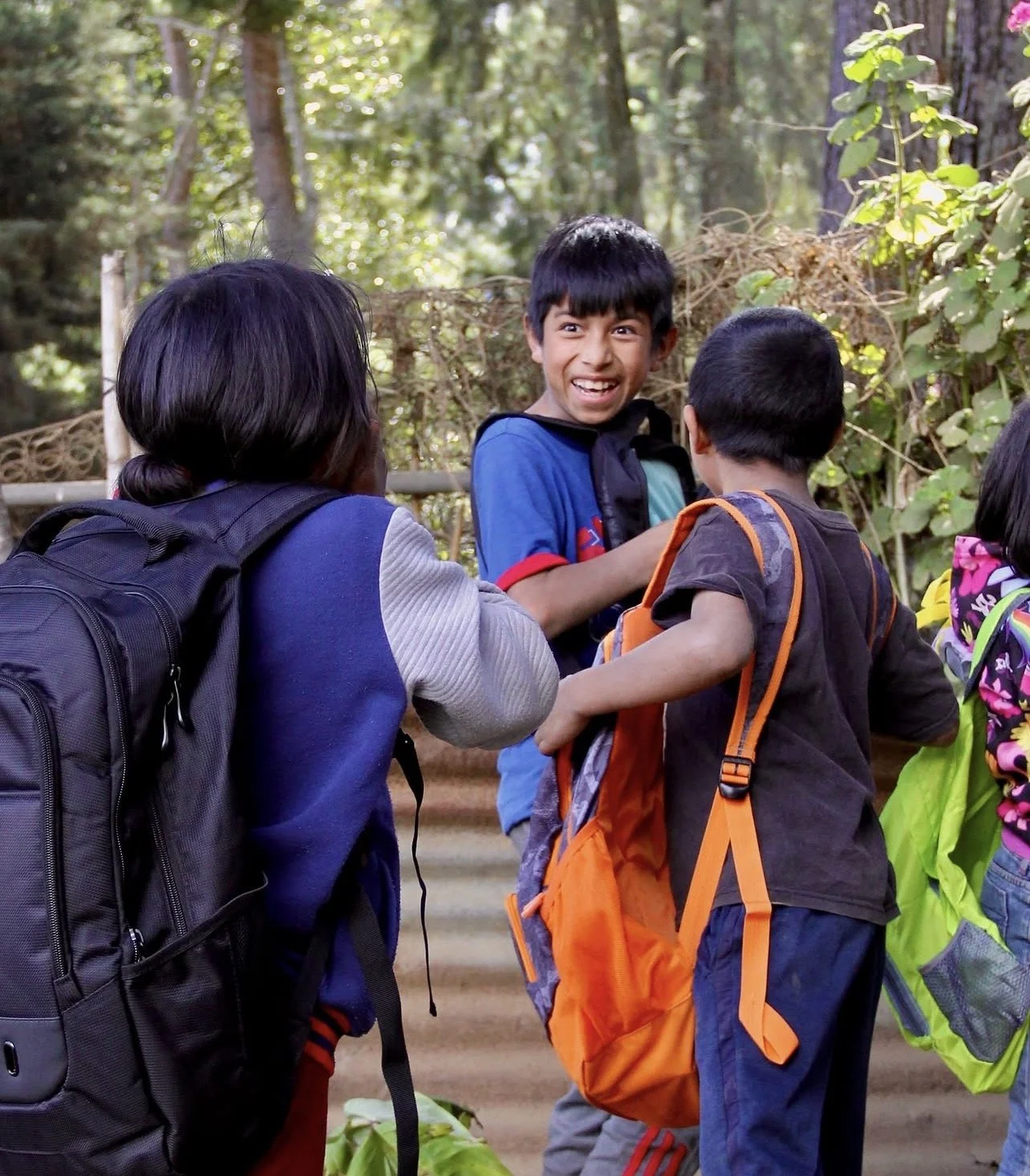Kids with new backpacks and school supplies (3)