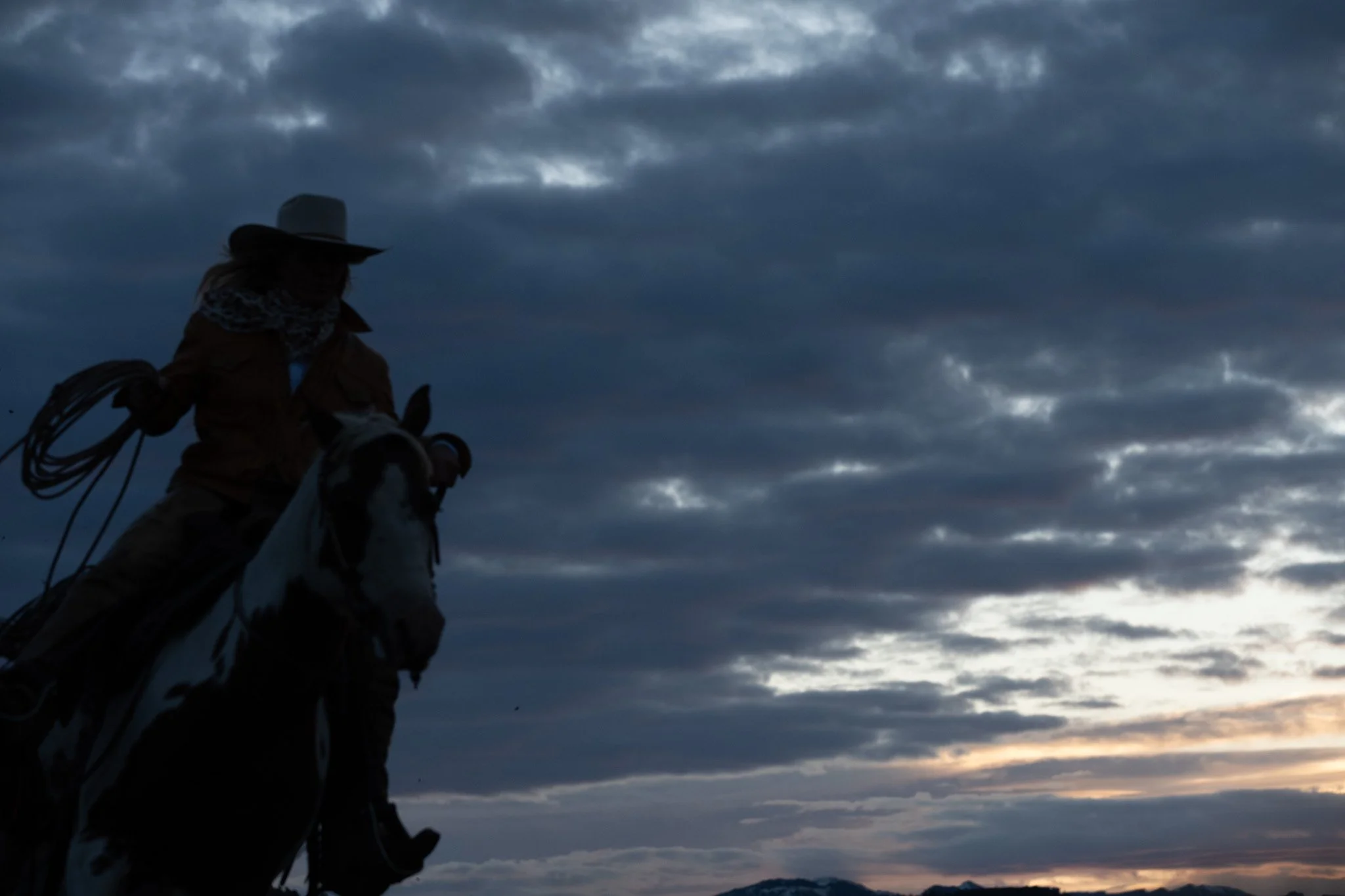 A rider beneath a broad cloudy sky