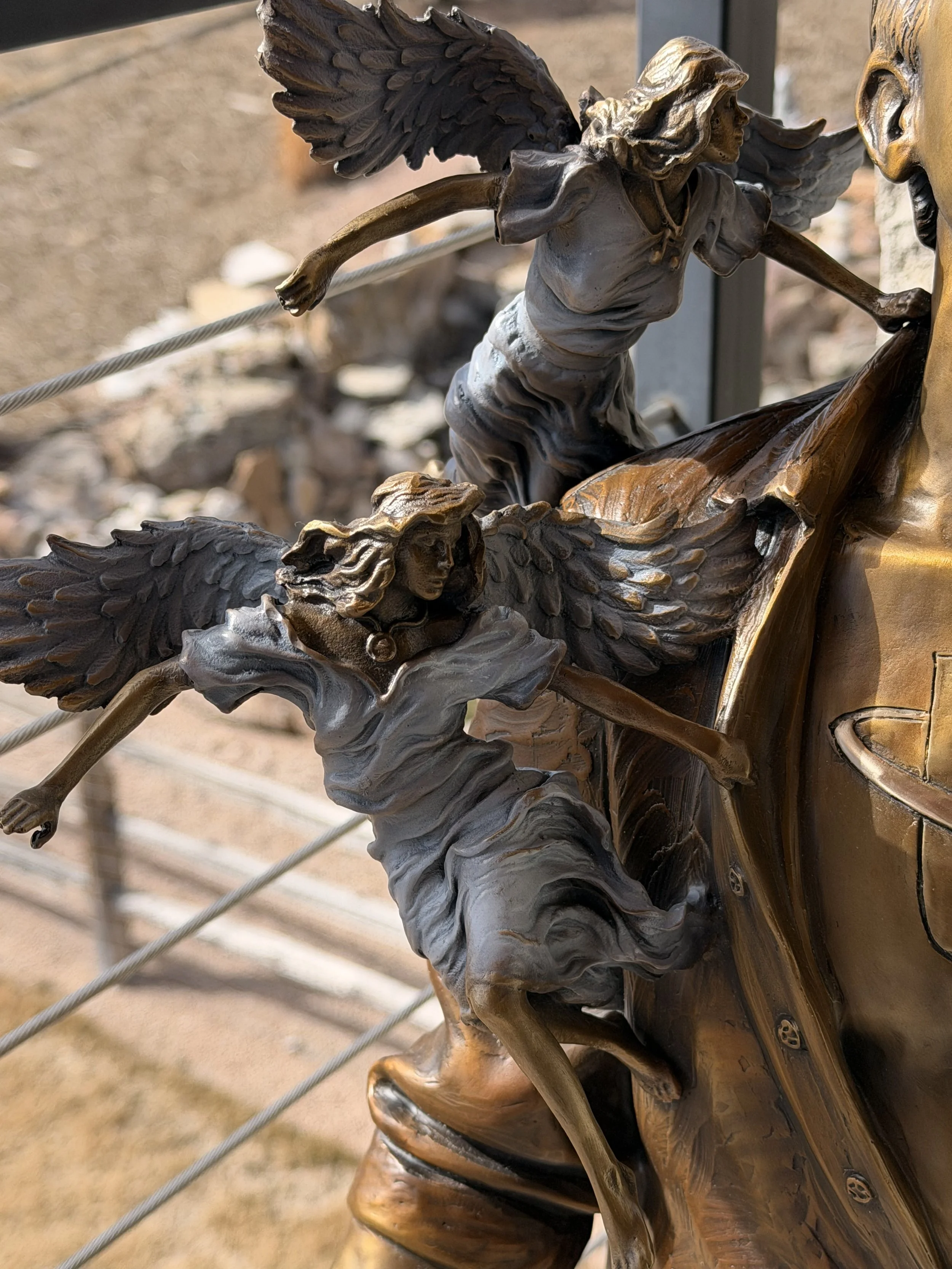 I/Universe sculpture — angel detail, right shoulder