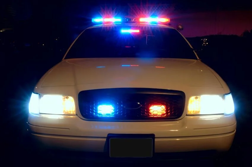 A sheriff’s patrol car at night