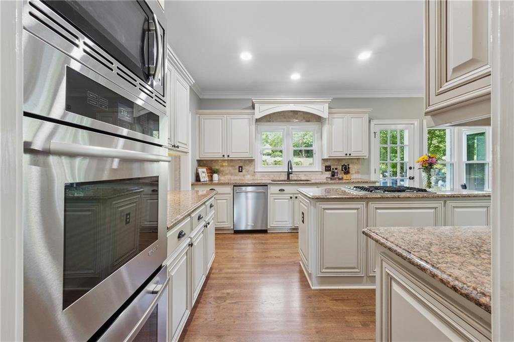 Chef’s kitchen with premium appliances at 590 Kensington Farms Drive, Milton GA