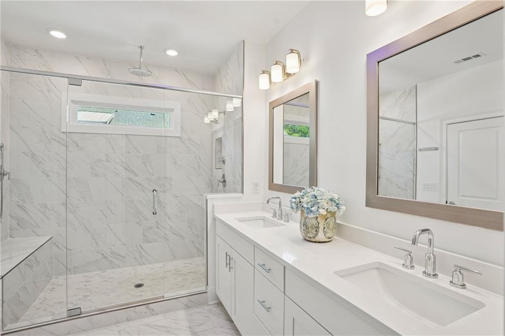 2004 Cortland Road modern bathroom with glass shower and tile finishes