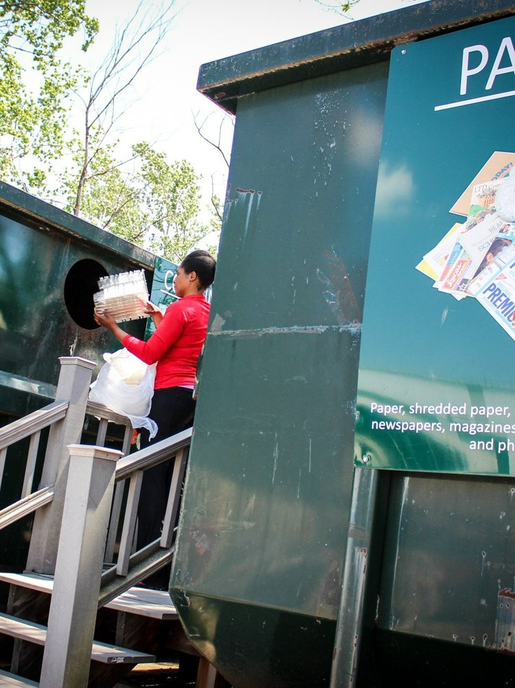Woman dropping off recyclables