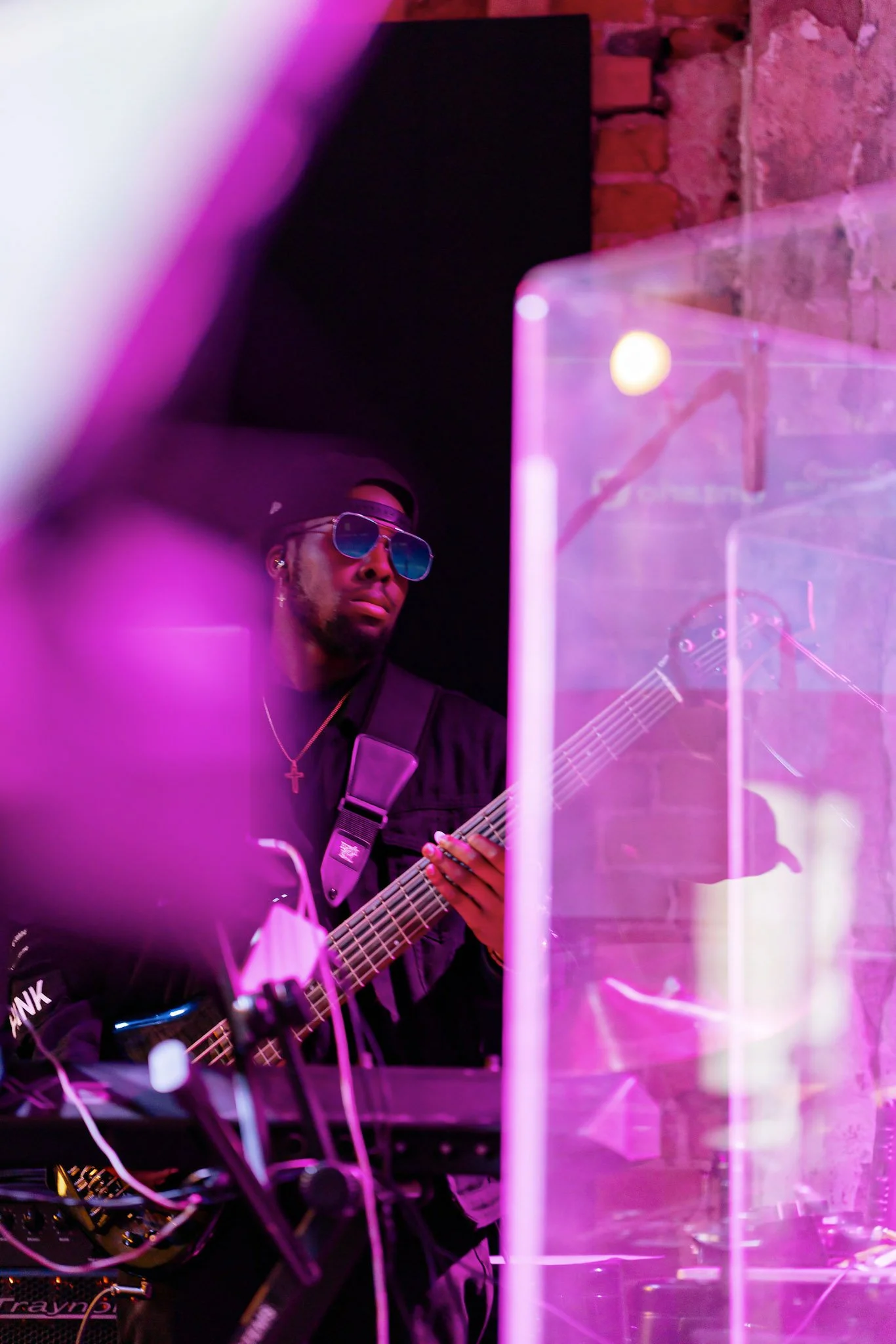 A bassist performing at the Blueprint finale