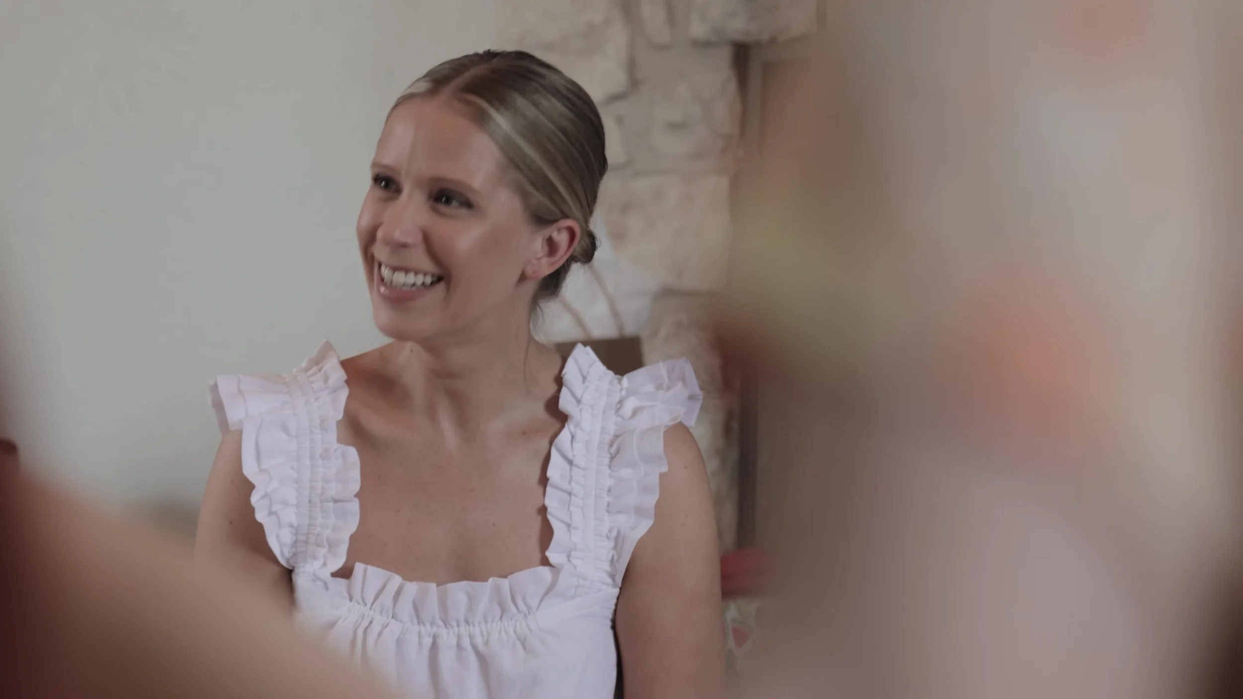 Super 8 close up of Heather smiling before the wedding at Lady Bird Johnson Wildflower Center in Austin, Texas