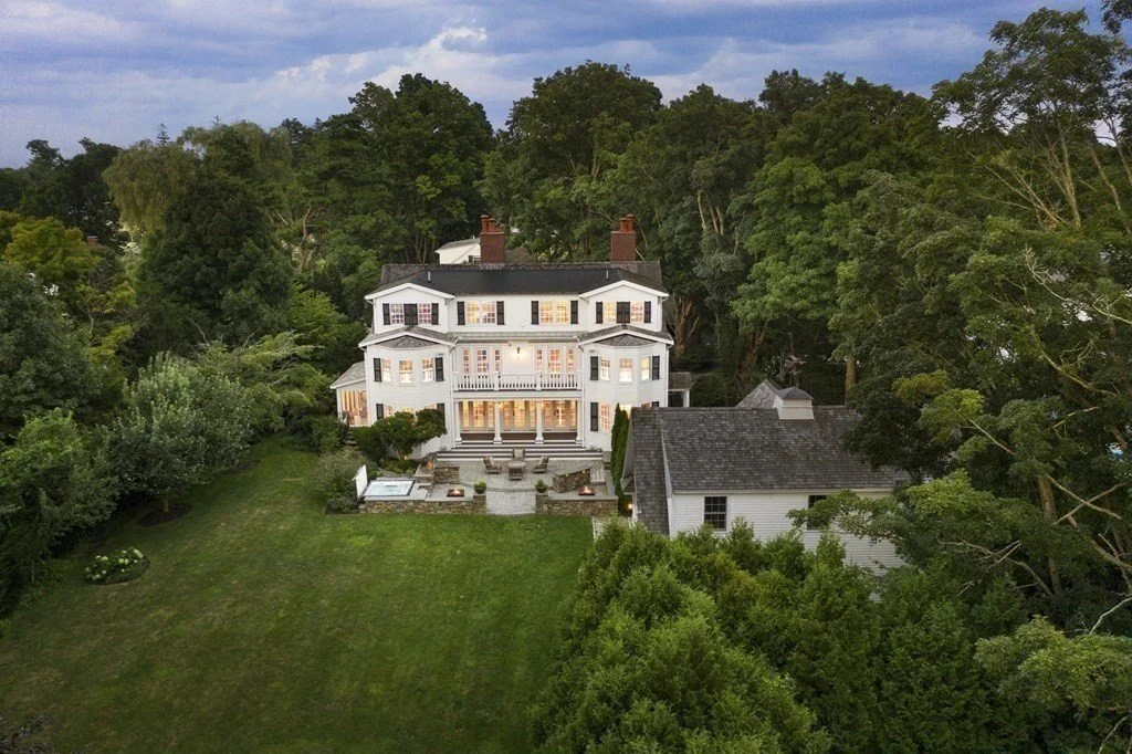 White Colonial mansion at twilight