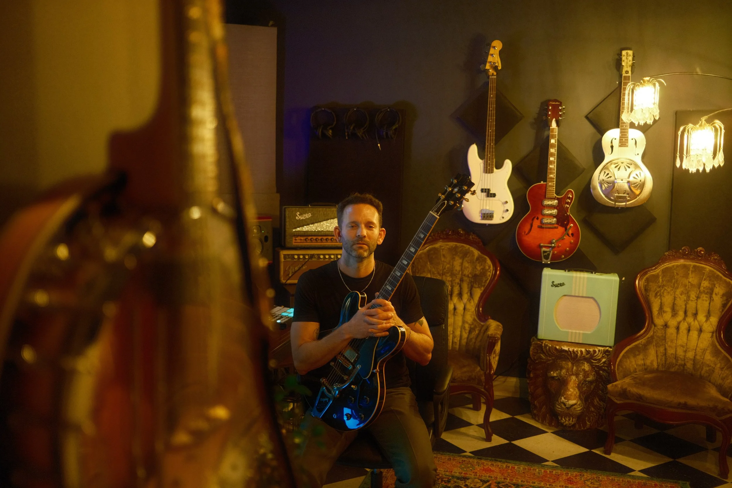 Tyler Cain playing electric guitar during a portrait session