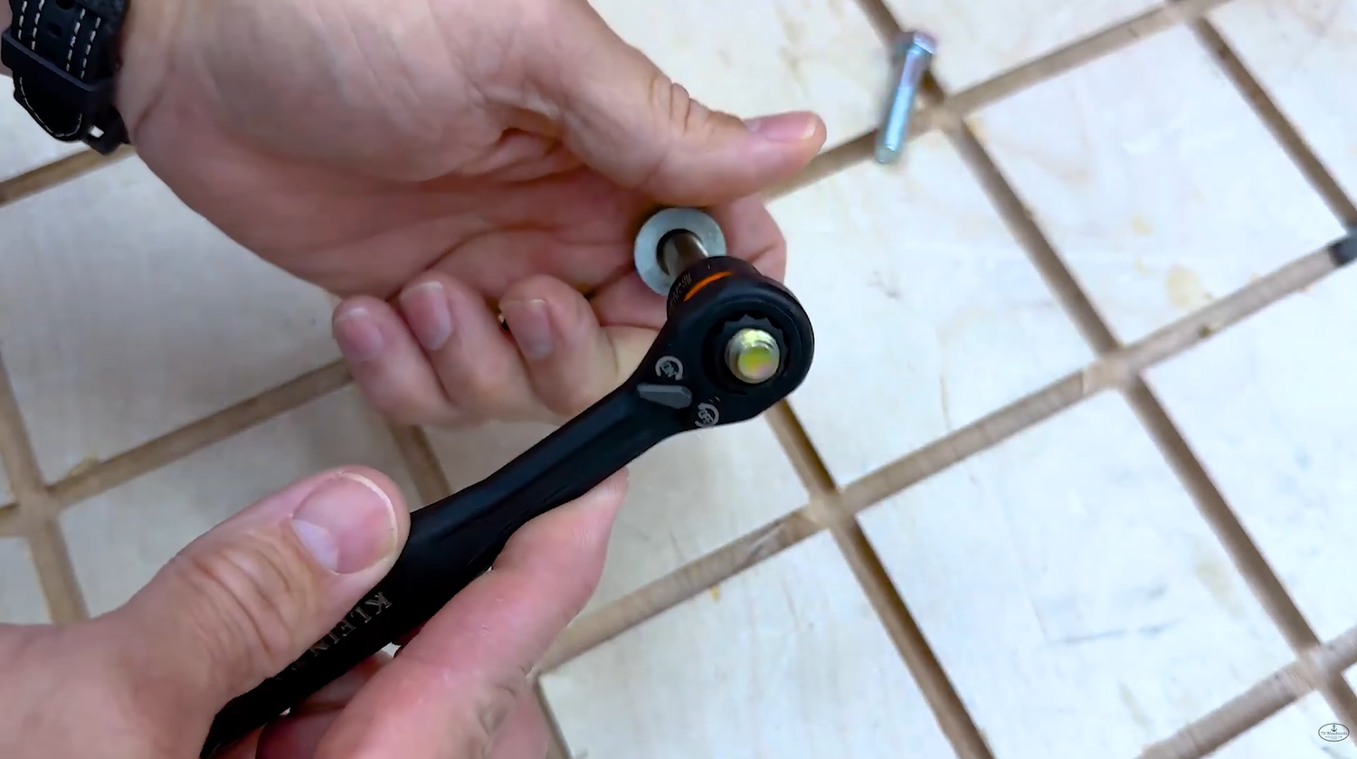 Threaded rod passing all the way through a Klein Tools KNECT pass through socket and ratchet
