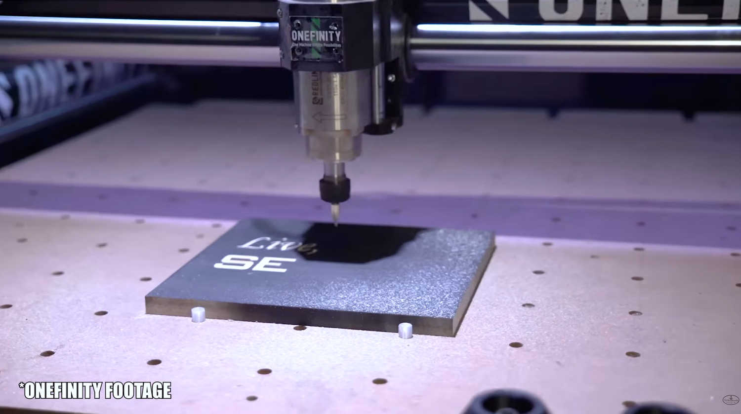 OneFinity CNC machine with thick-walled rails on display at a woodworking show