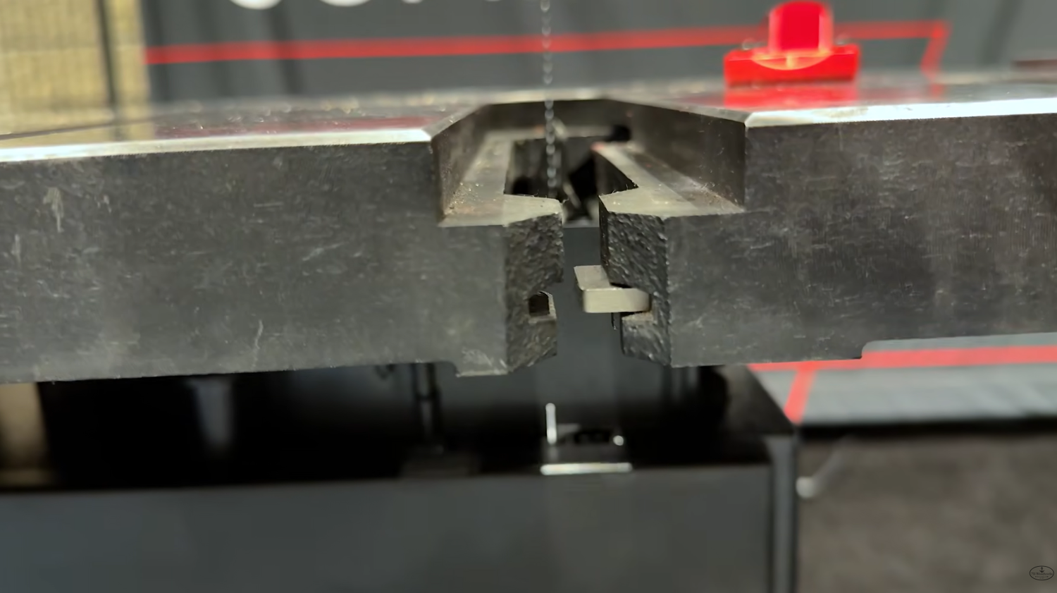 Table registration pin engaged on the SawStop Professional Bandsaw so the blade can pass out the front of the saw
