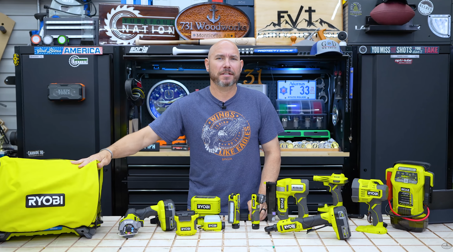 RYOBI 18V, 40V, and USB lithium tools from The Home Depot laid out together on a shop workbench