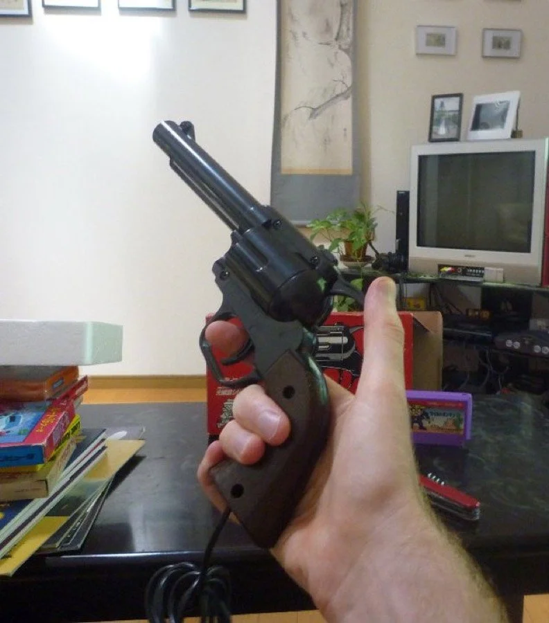 The Famicom Ray Gun revolver held in hand