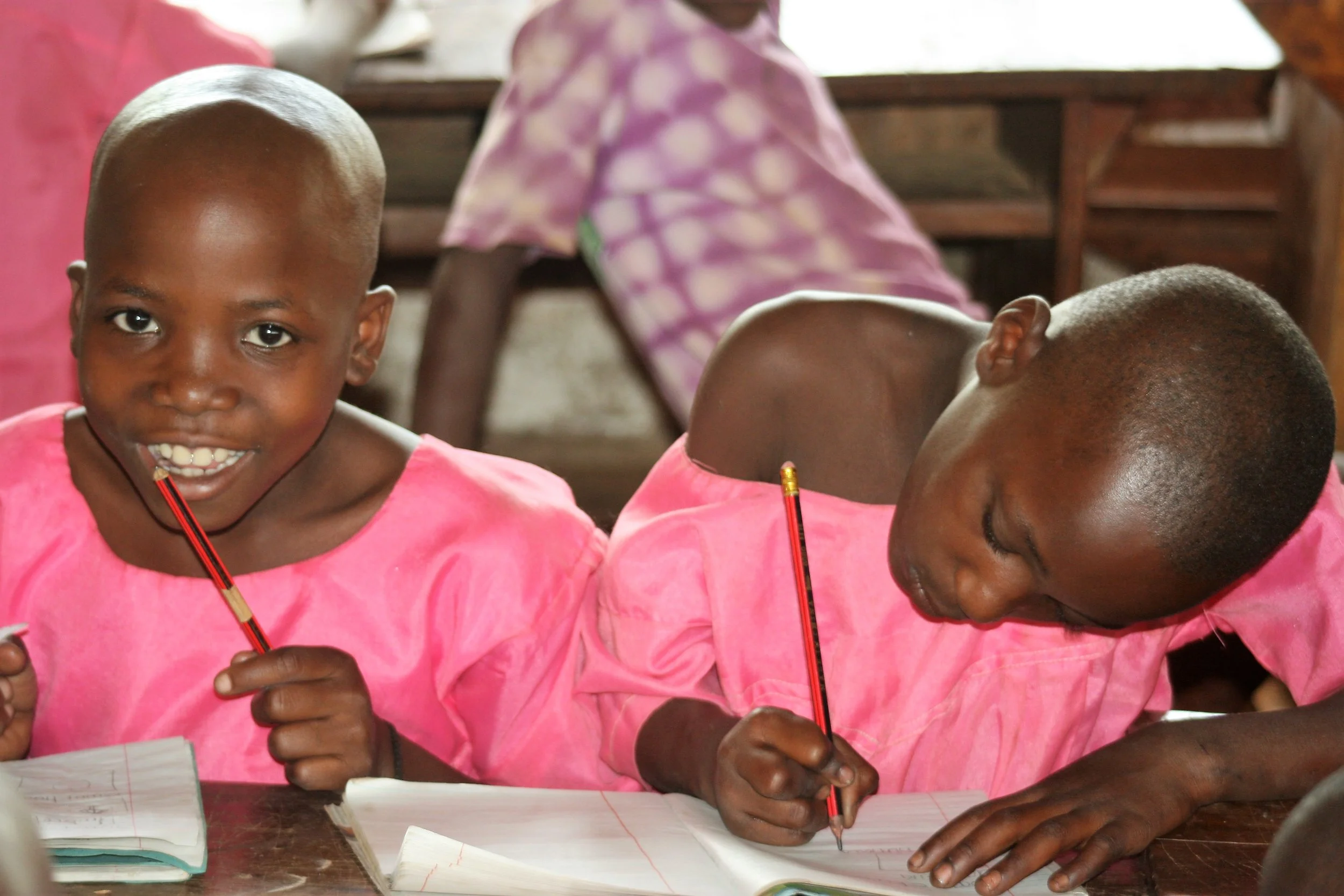 Children learning together in Uganda