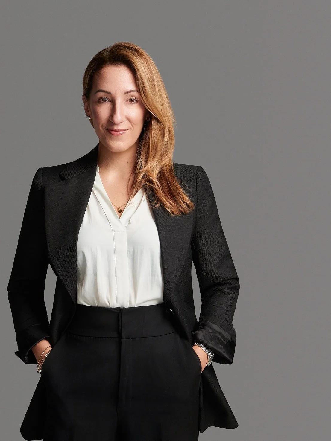 Team headshot, matching gray background