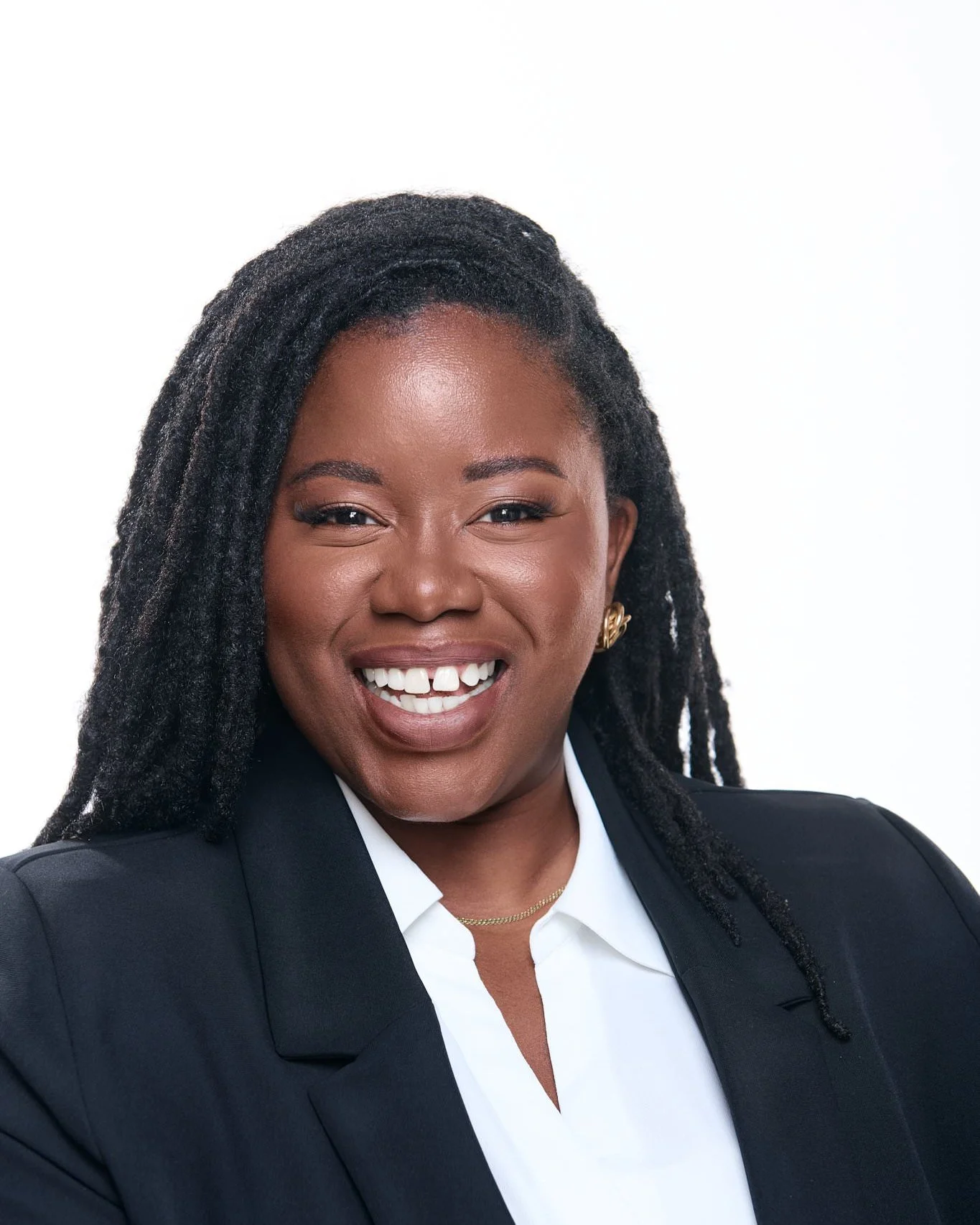 Smiling professional headshot in a black blazer