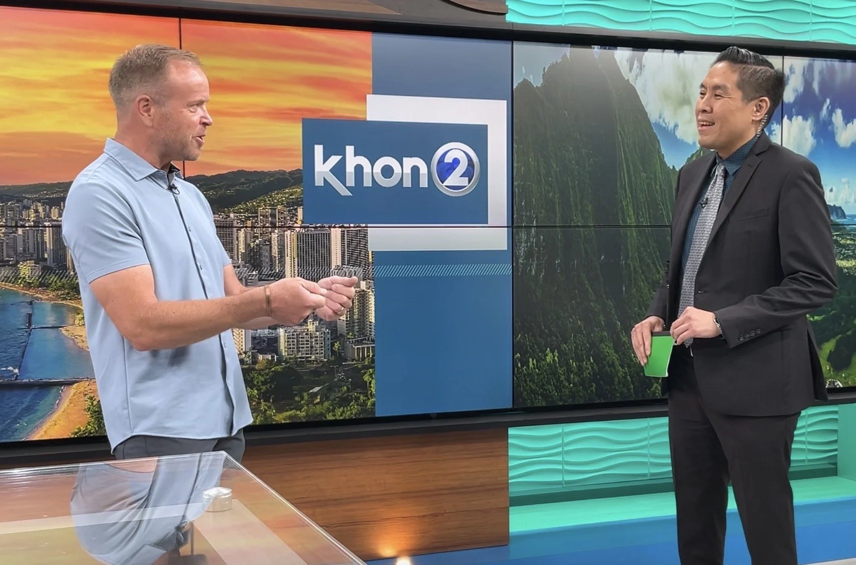 Dale Dixon speaking with a television news anchor in a studio