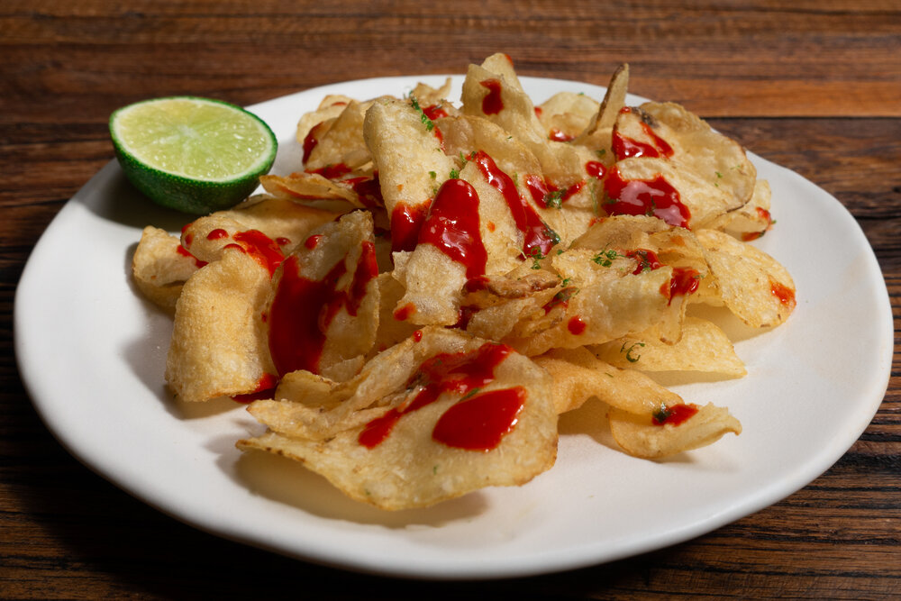 PAPAS CON COCHINADA - POTATO CHIPS WITH HOT SAUCE AND LIME