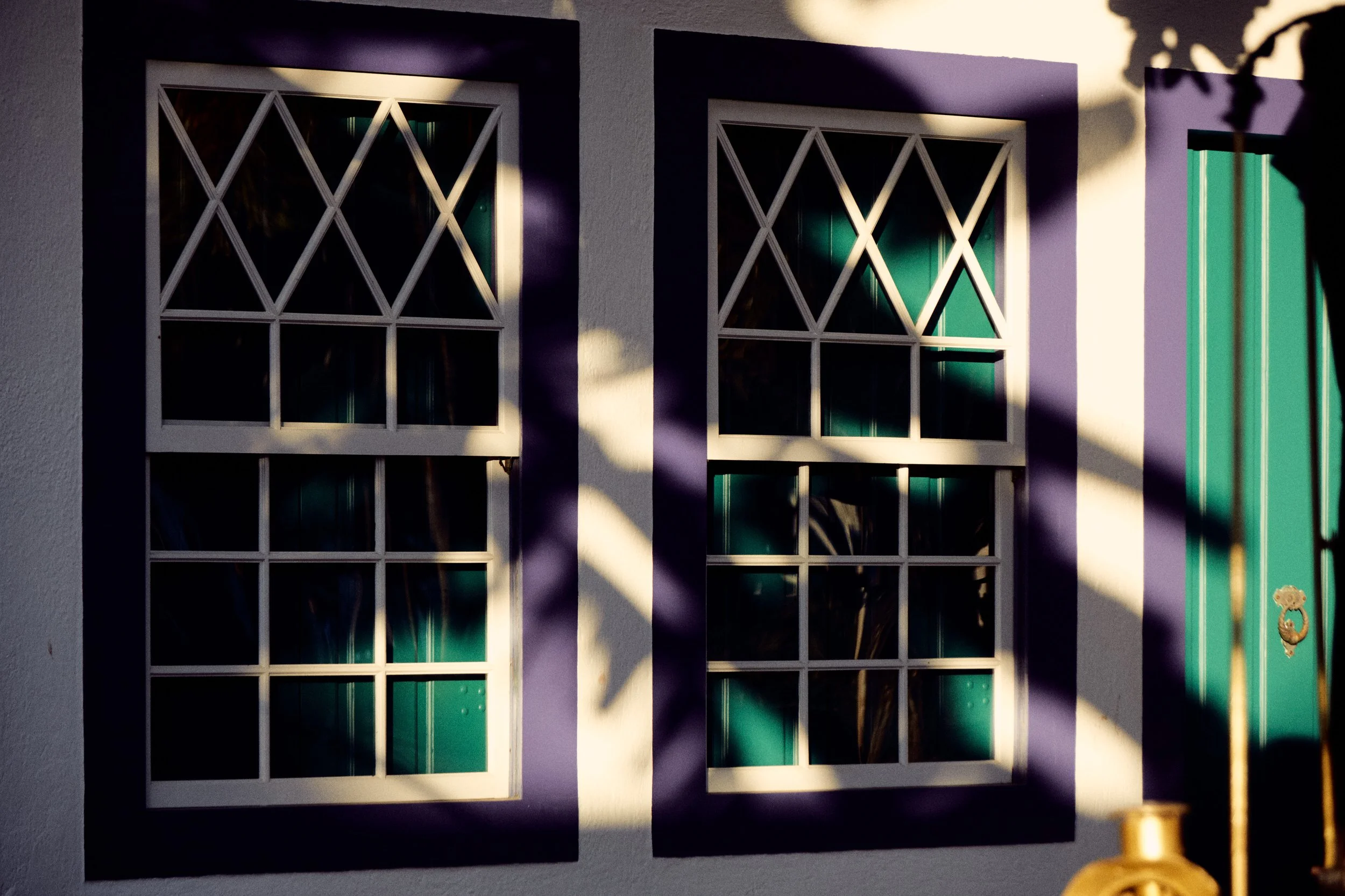 Windows, green door and shadows in Paraty