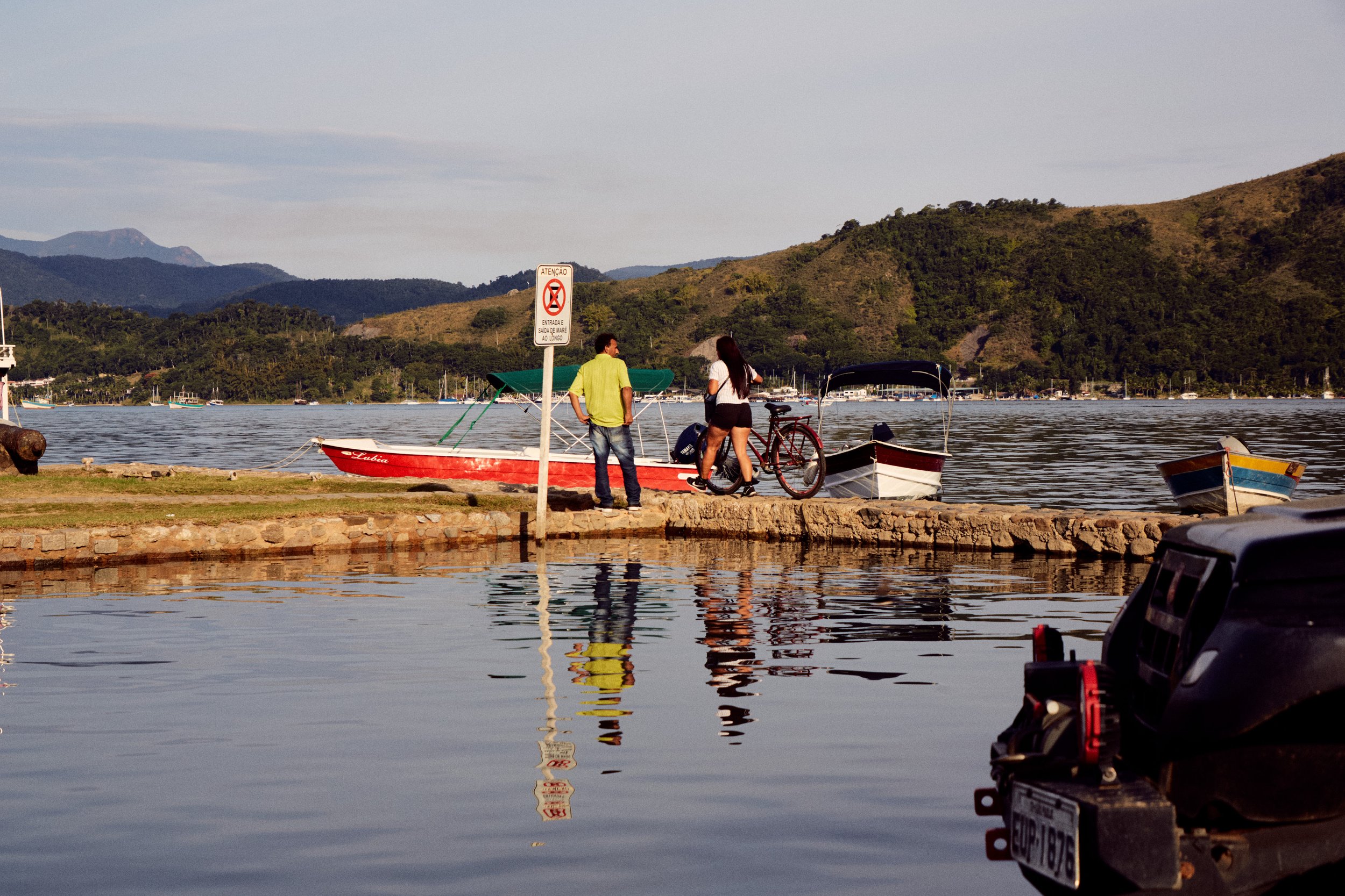 Boat, quay and water near Paraty