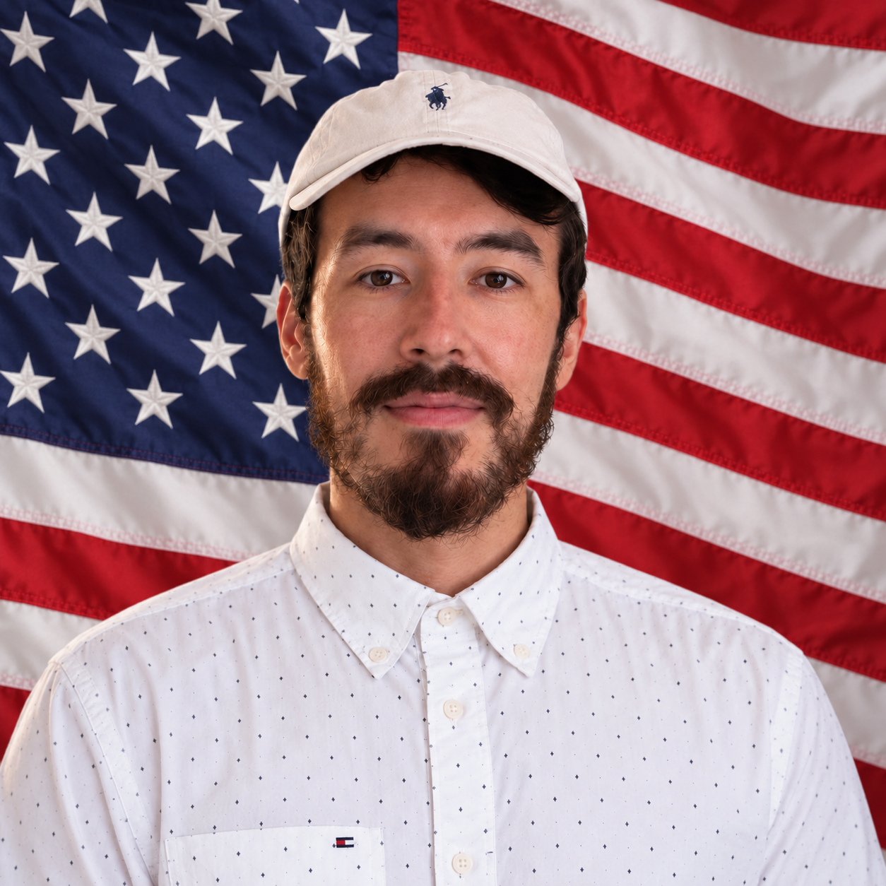 Ethan Avila in front of an American flag