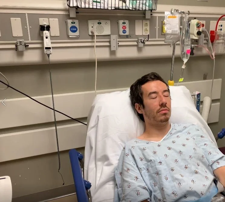 Ethan in a hospital bed for surgery