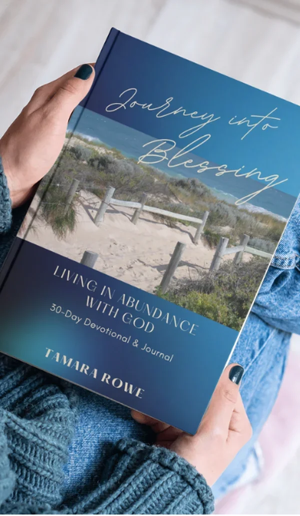 A person holding the Journey into Blessing 30-Day devotional and journal