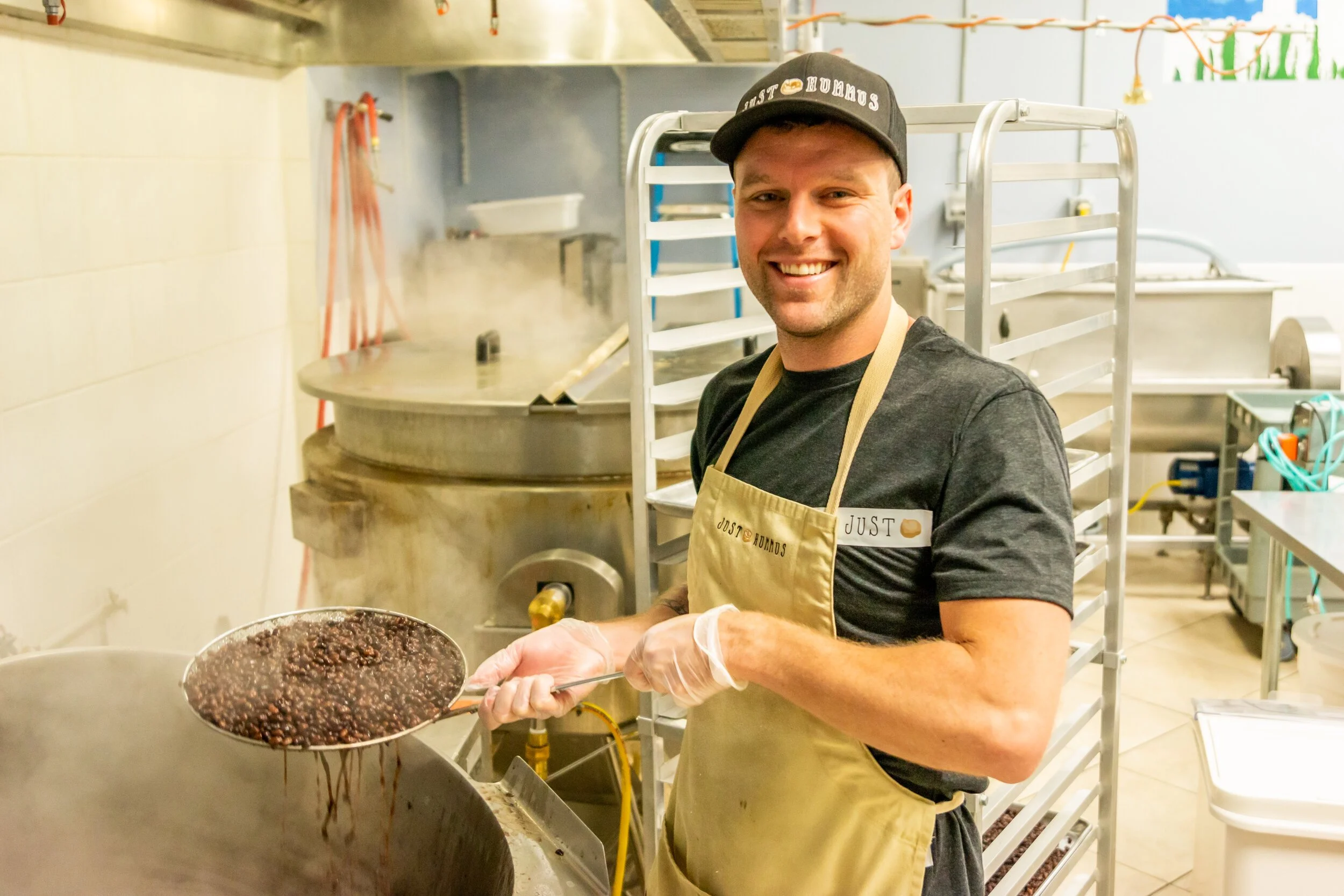 Just Us Foods founder, Colin Daly, in the company kitchen at 4am working on the production of the Just Us Foods products
